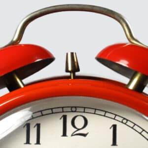 Phot of old red alarm clock for Time Management Workshop